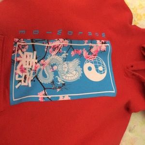 Im unsure about the brand but it’s a size medium, the color is red.